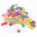 Abalorios de colores con forma de flor sonriente. Bolsita 20ud