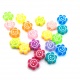 Abalorios de colores con forma de flor sonriente. Bolsita 20ud